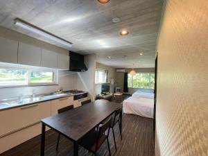 Ένα ή περισσότερα κρεβάτια σε δωμάτιο στο Niseko VILLA KIRAKU TSURU 車利用にオススメ 各スキー場迄車で約15分