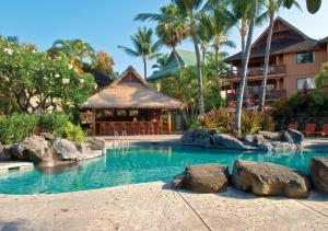 a swimming pool in front of a resort at Club Wyndham Kona Hawaiian Resort in Kailua-Kona