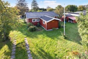 an aerial view of a house with a yard at Bogns Cabin in Holbæk