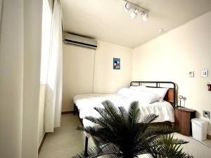 Hongdae Modern House客房内的一张或多张床位