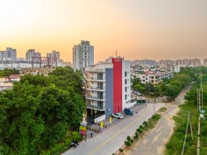 a view of a city with a red and blue building at The Hosteller Gurugram in Gurgaon