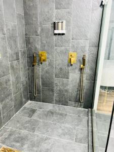 a bathroom with a shower with a glass door at Group Stay 3bd 2bth Ask about Deals in Birmingham