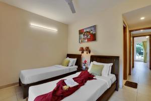 Veeraas Strand Park Apartment by Alaya Stays客房内的一张或多张床位