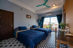 Postel nebo postele na pokoji v ubytování AN BANG CORNER HOUSE + 100 fotografií