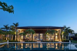 a house with a pool in front of it at YAMA Resort in Kibbutz Ginnosar