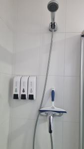 a shower head with a hose in a bathroom at Casa de la Santa in Moratalla +87 photos