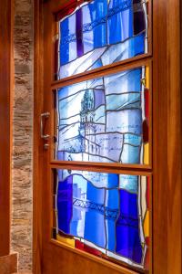 a door with a stained glass window of a building at Hotel Aroi Bierzo Plaza in Ponferrada