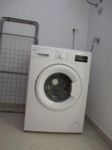 a washing machine in a room with at Relax Beach Apartment in Split