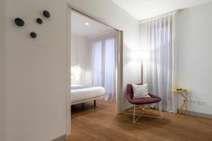 Postel nebo postele na pokoji v ubytování Aspasios City Oasis Apartments