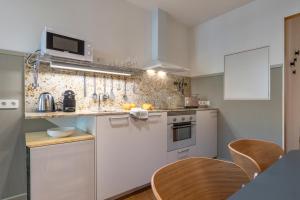 Kuchyň nebo kuchyňský kout v ubytování Aspasios City Oasis Apartments