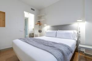 Postel nebo postele na pokoji v ubytování Aspasios City Oasis Apartments