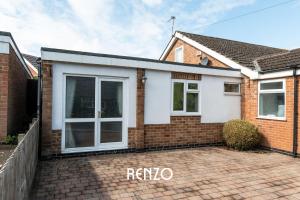 a brick house with a large sliding door at Cosy 1-bed Annexe in West Bridgford, Nottingham by Renzo, Free Driveway Parking! in Nottingham