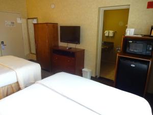 Postel nebo postele na pokoji v ubytování Sheridan Hotel