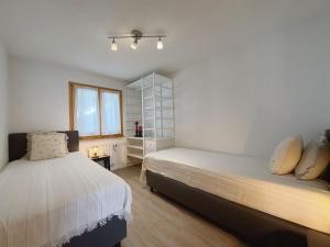 Voodi või voodid majutusasutuse Apartment Atlantic 112 by Interhome toas