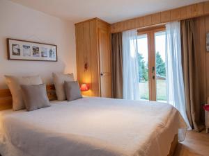 Ένα ή περισσότερα κρεβάτια σε δωμάτιο στο Apartment Baudrier A04 by Interhome