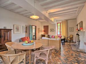 a living room with a table and chairs at Holiday Home Langevine by Interhome in Thorigné-dʼAnjou