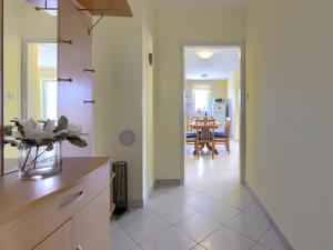 a kitchen with a counter and a dining room at Apartment Egle by Interhome in Rabac
