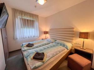 Postel nebo postele na pokoji v ubytování Apartment Mountain Resort-Kaprun by Interhome