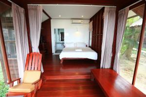 Llit o llits en una habitació de Tubtim Resort