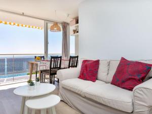 a living room with a couch and a table at Apartment Clipper by Interhome in Sant Vicenç de Montalt