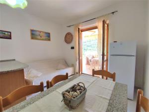 a kitchen with a table with a basket of eggs on it at Apartment Terrazza Cala Rossa by Interhome in Nisporto