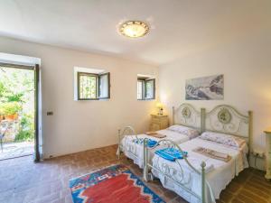 A bed or beds in a room at Holiday Home Vedi Torre by Interhome