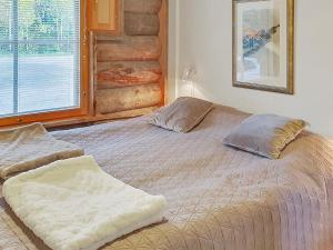 Ένα ή περισσότερα κρεβάτια σε δωμάτιο στο Holiday Home Kukasrakka 3 b 8 by Interhome