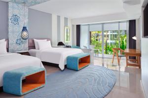 Postel nebo postele na pokoji v ubytování Le Meridien Bali Jimbaran
