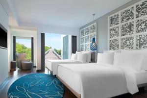 Postel nebo postele na pokoji v ubytování Le Meridien Bali Jimbaran