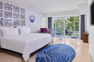 Postel nebo postele na pokoji v ubytování Le Meridien Bali Jimbaran