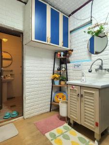 a small bathroom with a sink and a toilet at Appletree Guesthouse in Seoul