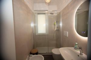 a bathroom with a shower and a sink and a toilet at Casa Primavera in Ventimiglia