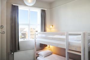 Postel nebo postele na pokoji v ubytování Fosshotel Baron