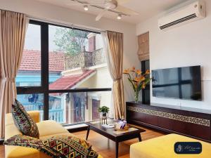 a living room with a large window and a tv at High-ser Apartment -2BR - NiceView - Parking - Spacious - In center in Hanoi