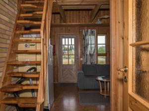 a staircase in a tiny house with a living room at Holiday Home Ylläskarpalo 3 päätyhuoneisto by Interhome in Äkäslompolo