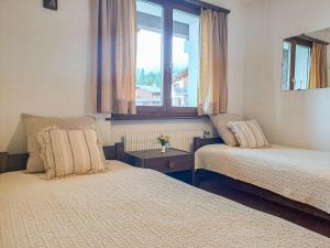 Postel nebo postele na pokoji v ubytování Apartment Galaxie 217 by Interhome + 8 fotografií