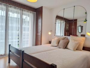 Postel nebo postele na pokoji v ubytování Apartment Galaxie 217 by Interhome