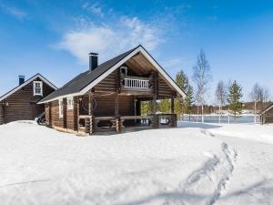 a log cabin in the snow at Holiday Home Vuokatticottage f by Interhome in Vuokatti