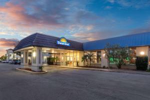 aldi store with a sign on the front of it at Days Inn by Wyndham Titusville Kennedy Space Center in Titusville