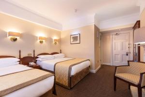 Letto o letti in una camera di Wynn's Hotel