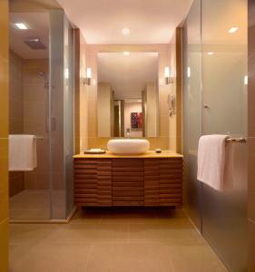 a bathroom with a sink and a shower at Hyatt Regency Kinabalu in Kota Kinabalu