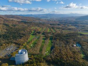 an aerial view of a building in the woods at Hilton Niseko Village in Niseko