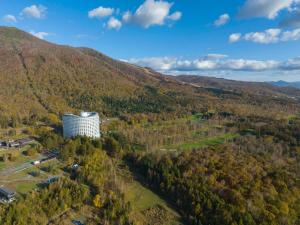 an aerial view of a building in the mountains at Hilton Niseko Village in Niseko