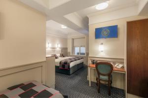 Letto o letti in una camera di Wynn's Hotel