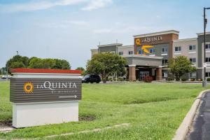 a sign in front of a building at La Quinta by Wyndham Evansville in Evansville