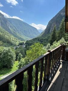 a balcony with a view of a valley at Cozy Chalet With Mountain Views in Ussin, Valtourneche, Parking in Chamois