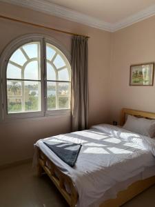 Postel nebo postele na pokoji v ubytování Harmony House Luxor