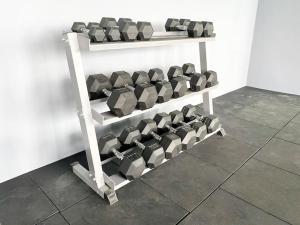 a shelf with rows of dumbbells in a room at The Podium-12 Pax in Kuching