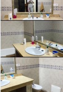 La salle de bains est pourvue d'un lavabo, de toilettes et d'un miroir. dans l'établissement Appartement à résidence Ap8 , marina , saidia, à Berkane