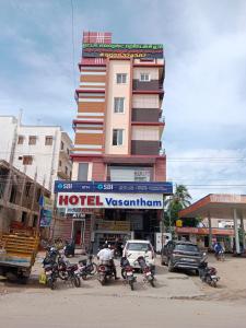a hotel with motorcycles parked in front of a building at Hotel Everest Residency in Tiruvannāmalai
